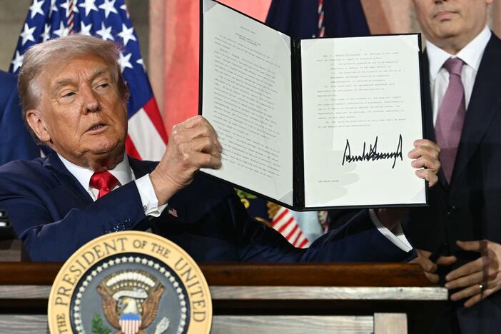 President Trump displays an executive order on artificial intelligence he signed in Washington, DC, on July 23, 2025.