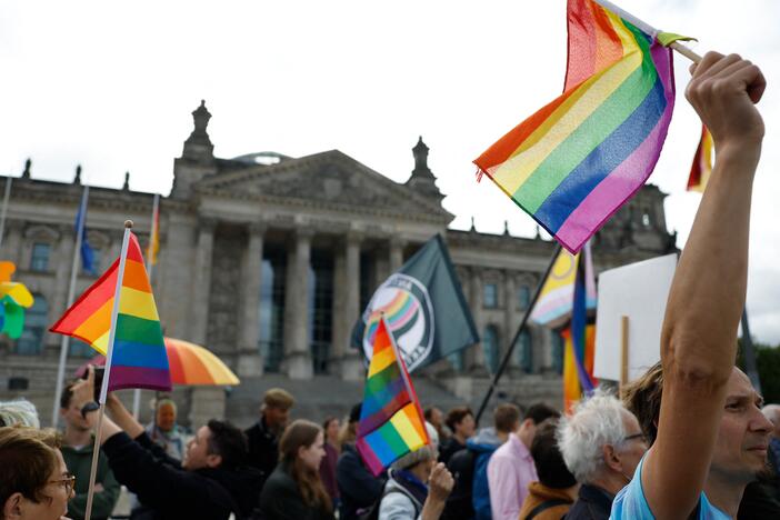 Demonstrators participate in an event called "Show the flag: For queer visibility in the Bundestag!" in front of the Reichstag building that houses Germany's lower house of parliament, the Bundestag, in Berlin, on July 8. The conservative president of the Bundestag said the rainbow flag would no longer be raised on top of the parliament building during Pride month, which in Germany runs from June 28 until July 27.
