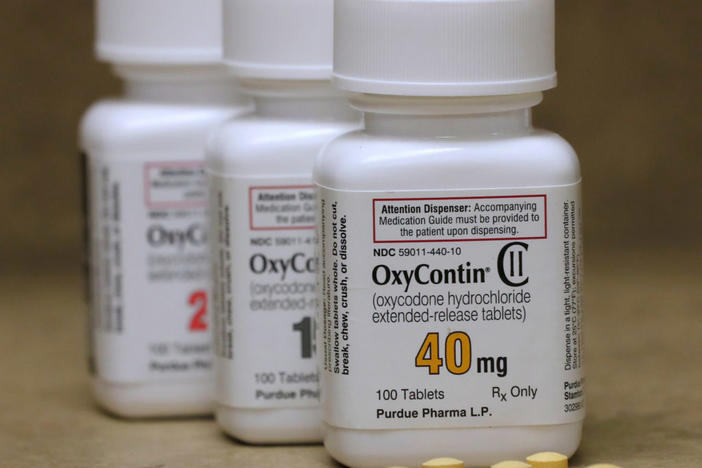 Bottles of prescription painkiller OxyContin pills, made by Purdue Pharma LP sit on a counter at a local pharmacy in Provo, Utah, U.S., April 25, 2017. Photo by: George Frey/File Photo/Reuters
