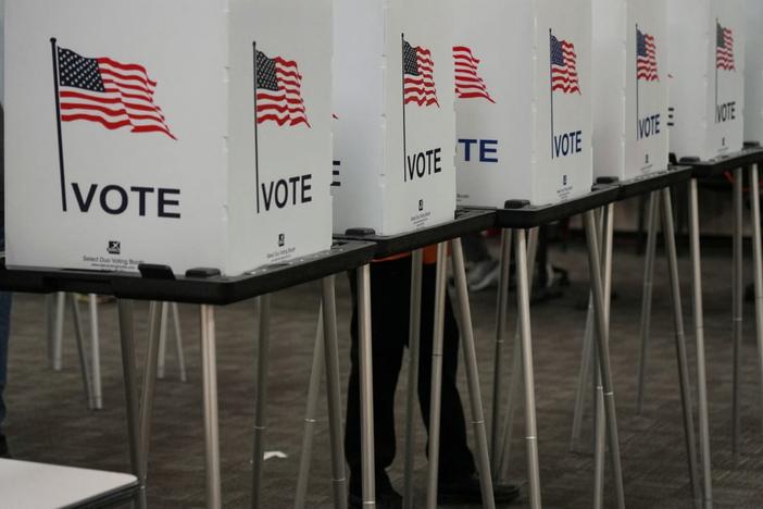 Voting booths are pictured inside the Dona Ana County Government Center during early voting for the upcoming midterm elections in Las Cruces, New Mexico, U.S., October 24, 2022. REUTERS/Paul Ratje