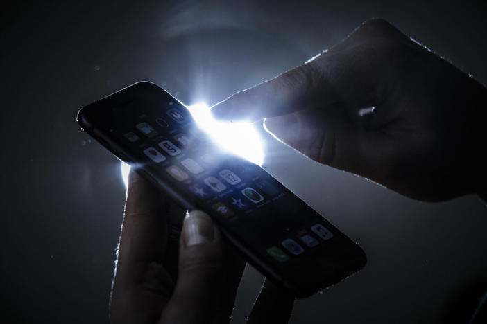 Berlin, Germany - February 12: Symbolic photo on the subject of data security on the smartphone. Hands are typing on a smartphone on February 12, 2018 in Berlin, Germany. (Photo by Thomas Trutschel/Photothek via Getty Images)