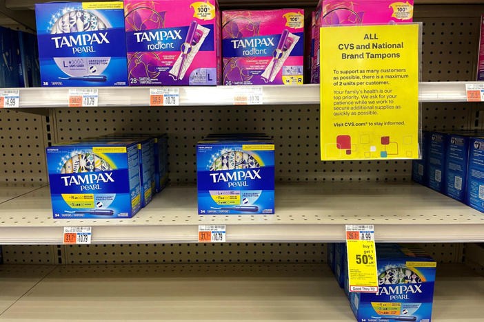 A sign notifies customers that there is a limit of two units per customer buying "all CVS and national brand tampons" at a CVS drug store in Somerville, Massachusetts, U.S., June 29, 2022. REUTERS/Brian Snyder
