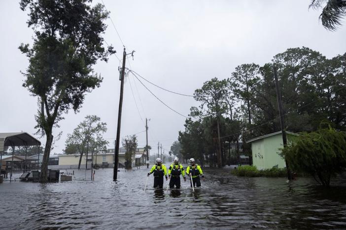 Miami Search and Rescue Fire Department personnel search for people in flooded houses as Hurricane Debby affects the gulf coast in Suwannee, Florida, U.S., August 5, 2024. REUTERS/Ricardo Arduengo