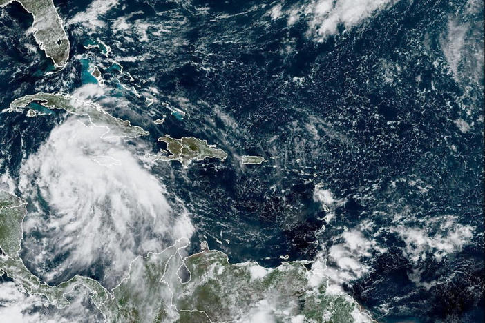 FILE PHOTO: Tropical Storm Ian is seen near the coast of Cuba in this satellite image taken September 25, 2022. National Oceanic and Atmospheric Administration (NOAA)/Handout via REUTERS THIS IMAGE HAS BEEN SUPPLIED BY A THIRD PARTY/File Photo