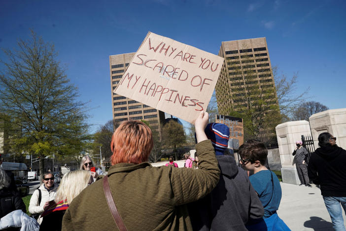 A demonstrator holds a sign during a protest rally after Georgia's House and Senate voted to prohibit most medical treatments to minors that help affirm gender identity, outside the Capitol Building in Atlanta, Georgia, U.S. March 20, 2023. Photo by Megan Varner/REUTERS
