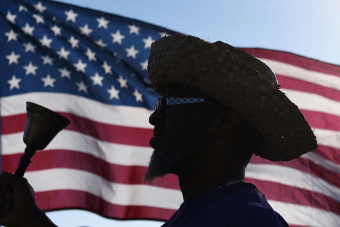 Brock Harrell, of Galveston, rings a bell during a reenactment to celebrate Juneteenth, which commemorates the end of slavery in Texas, two years after the 1863 Emancipation Proclamation freed slaves elsewhere in the United States, in Galveston, Texas, June 19, 2021. REUTERS/Callaghan O'Hare