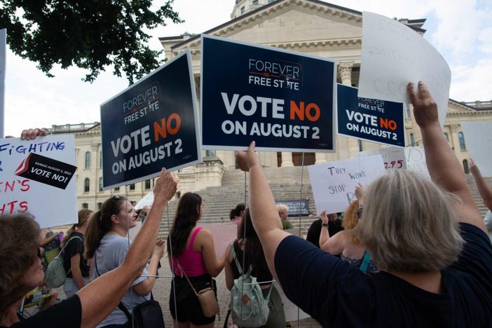 Abortion-rights supporters hold signs related to a bill that could open the door to legislation limiting or banning abortions in the state during a rally Friday at the Kansas Statehouse following the U.S. Supreme Court's decision to overturn Roe v. Wade. Photo by Evert Nelson/The Capital-Journal / USA TODAY NETWORK