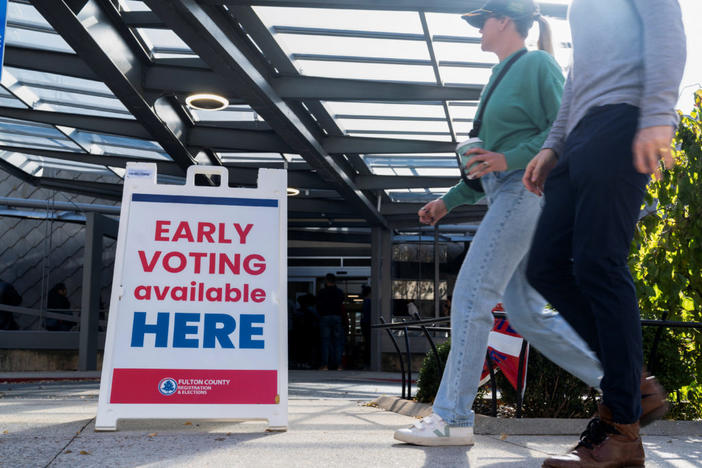 Voters attend to cast their ballots in the runoff election for the Senate position, between Democratic incumbent Raphael Warnock and Republican candidate Herschel Walker, at the Metropolitan Library, in Atlanta, Georgia, U.S., November 29, 2022. REUTERS/Megan Varner