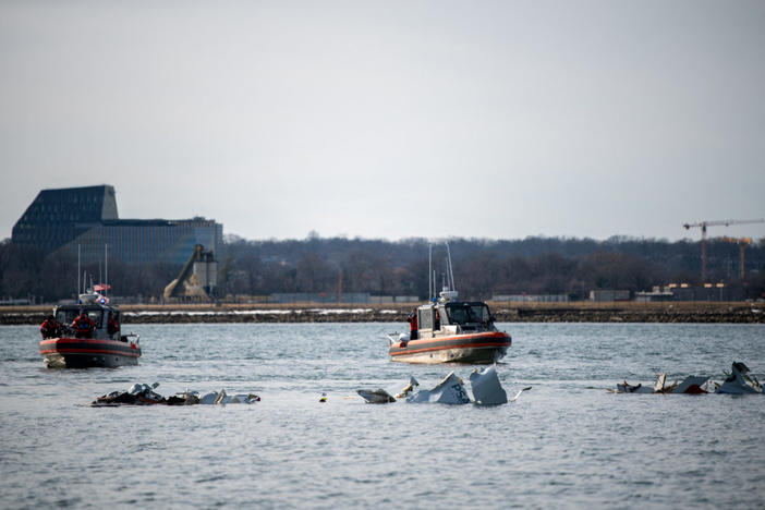 U.S. Coast Guard, along with other search and rescue teams, operate near debris at the crash site in the Potomac River in a location given as Washington, in the aftermath of the collision of American Eagle flight 5342 and a Black Hawk helicopter that crashed into the Potomac River, U.S. January 30, 2025. Photo courtesy of Taylor Bacon/U.S. Coast Guard/Handout via REUTERS