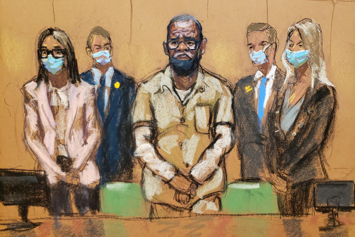 R. Kelly stands with his lawyers Jennifer Bonjean and Ashley Cohen during his sentencing hearing for federal sex trafficking at the Brooklyn Federal Courthouse in Brooklyn, New York, U.S., Jun. 29, 2022 in this courtroom sketch. Jane Rosenberg/REUTERS