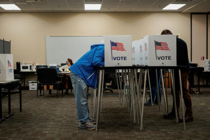 People vote early for the upcoming midterm elections in Las Cruces, New Mexico, U.S., October 24, 2022. REUTERS/Paul Ratje