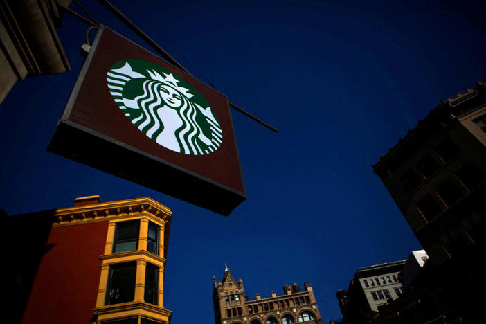 FILE PHOTO: The sign of a Starbucks store is seen in New York January 24, 2014. REUTERS/Eric Thayer/File Photo/File Photo