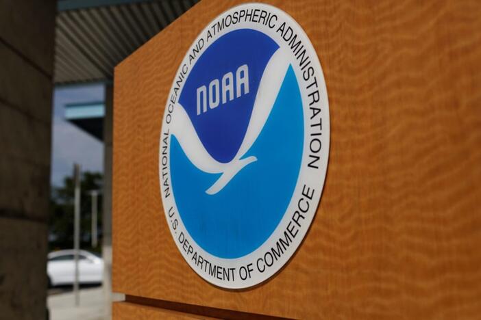 The logo of the National Oceanic and Atmospheric Administration is seen at the National Hurricane Center in Miami, Florida, U.S. August 29, 2019. REUTERS/Marco Bello