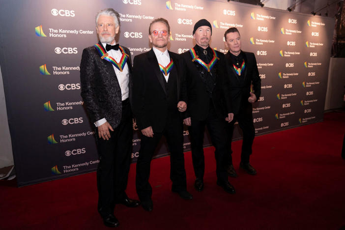 Kennedy Center honorees U2 band members Adam Clayton, Bono, The Edge, and Larry Mullen Jr., pose for a photo on the red carpet at the Kennedy Center honorees gala in Washington, D.C., U.S., December 4, 2022. REUTERS/Sarah Silbiger