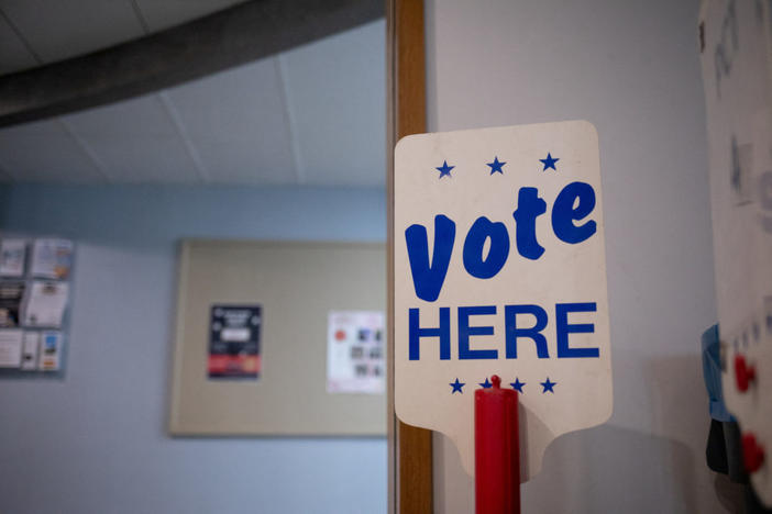 A 'Vote Here' sign is seen at a precinct the day before Michigan Democrats and Republicans choose their nominees to contest November's congressional elections, which will determine which party controls U.S. House of Representatives for next two years, in Birmingham, Michigan, U.S. August 1, 2022. REUTERS/Emily Elconin