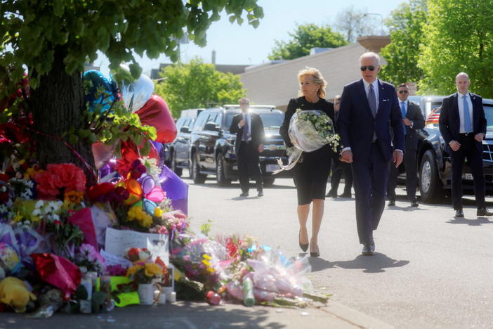 U.S. President Joe Biden and first lady Jill Biden pay their respects to the 10 people killed in a mass shooting by a gunman authorities say was motivated by racism, at the TOPS Friendly Markets memorial site in Buffalo, NY, U.S. May 17, 2022. REUTERS/Leah Millis