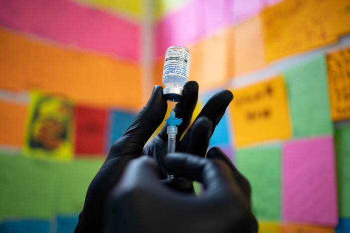 Dr. Mayank Amin draws the Moderna coronavirus disease (COVID-19) booster vaccine targeting BA.4 and BA.5 Omicron sub variants at Skippack Pharmacy in Schwenksville, Pennsylvania, U.S., September 8, 2022. REUTERS/Hannah Beier