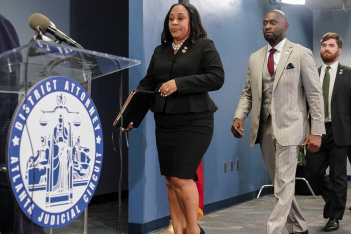 Fulton County District Attorney Fani Willis arrives at a press conference with prosecutor Nathan Wade after a Grand Jury brought back indictments against former president Donald Trump and his allies in their attempt to overturn the state's 2020 election results, in Atlanta, Georgia, U.S. August 14, 2023. REUTERS/Elijah Nouvelage.