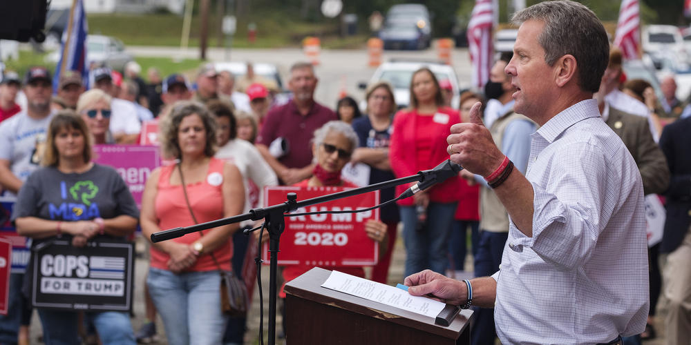 Gov. Brian Kemp speaks at a pro-Trump rally in Manchester, Georgia, ahead of Joe Biden's later visit to nearby Warm Springs on Oct. 27, 2020.
