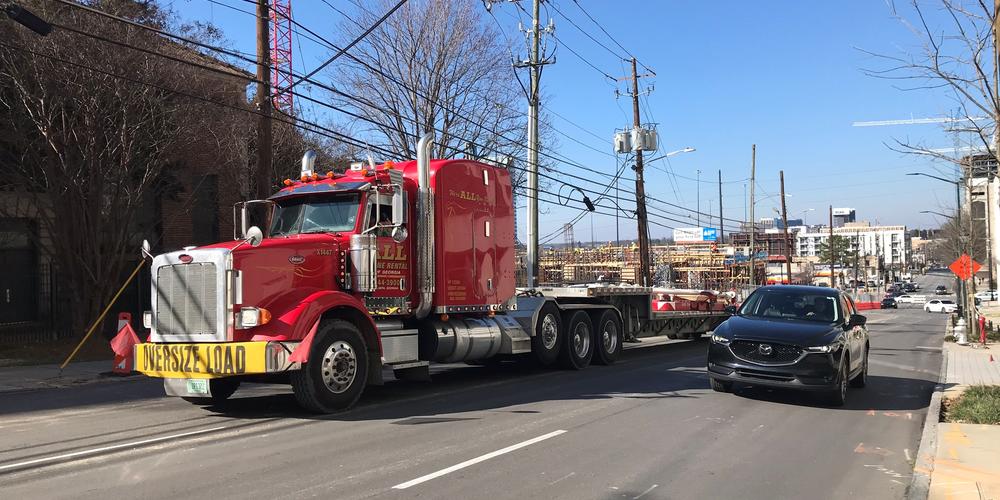 Crews work to remove leaning and "possibly unstable" crane in midtown Atlanta on Friday, Feb. 19, 2021