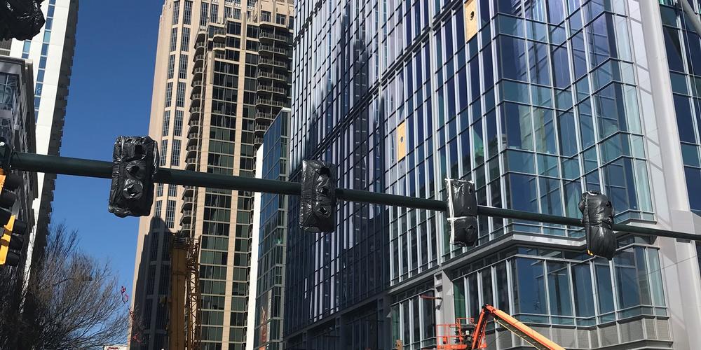 Crews work to remove leaning and "possibly unstable" crane in midtown Atlanta on Friday, Feb. 19, 2021
