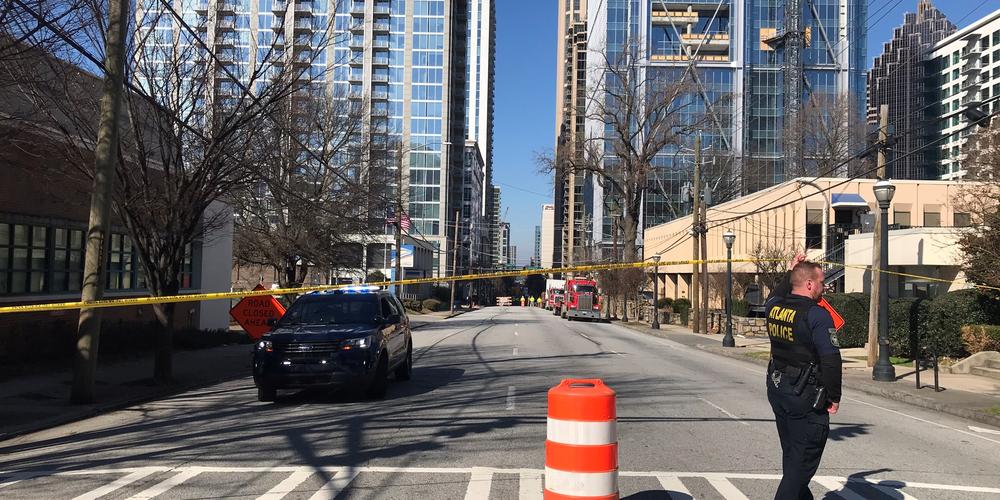 Crews work to remove leaning and "possibly unstable" crane in midtown Atlanta on Friday, Feb. 19, 2021