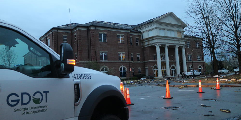 Georgia Dept. of Transportation crews clean up roadways near the Coweta County Court Clerk's Office in Newnan, Ga.