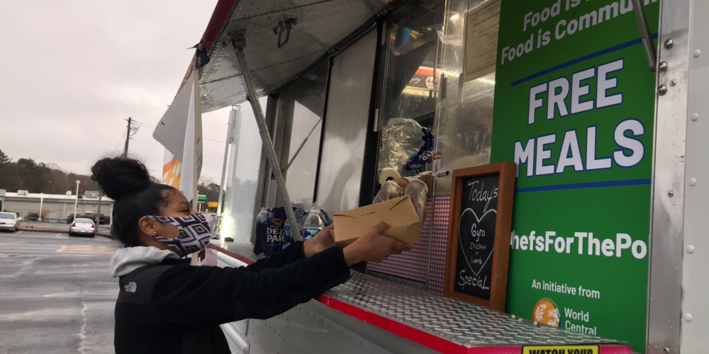 Voter receiving their food at the polling place.