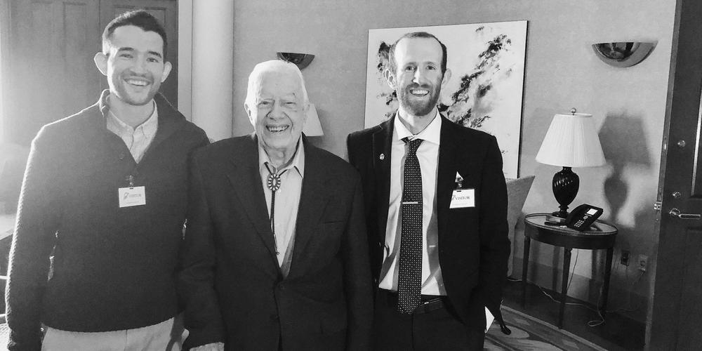 Filmmakers of CARTERLAND stand next to President Jimmy Carter.