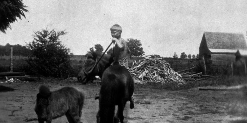 In 1928, the Carter family moved to a 350-acre farm near Plains in the tiny community of Archery, Georgia. The young Carter is pictured here atop his Shetland pony named Lady.