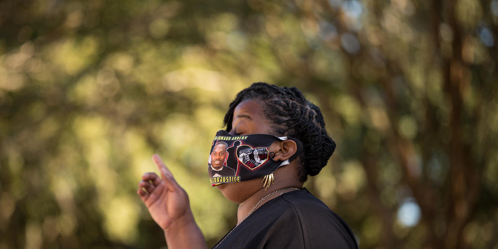 Ahmaud Arbery’s Aunt, Theawanza Brooks, prays outside of the Glynn County Courthouse in Brunswick on Oct. 17 during a vigil to honor Arbery ahead of the trial of the three white men charged in his killing.