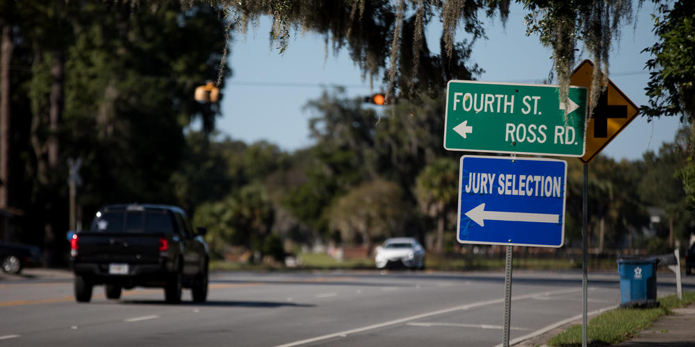A sign directs Glynn County’s 1,000 potential jurors to Selden Park, a mass jury selection spot as the trial gets underway on Oct. 18.