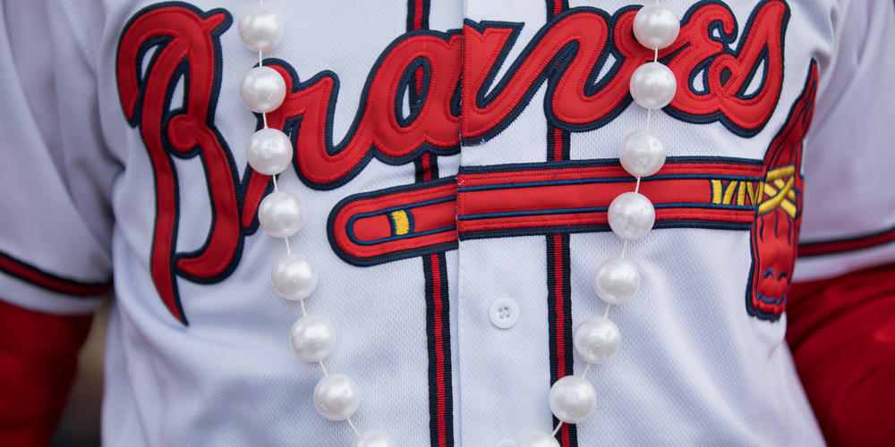 Braves fans don pearls during the celebration at Truist Park on Nov. 5 in honor of Braves outfielder Joc Pederson.