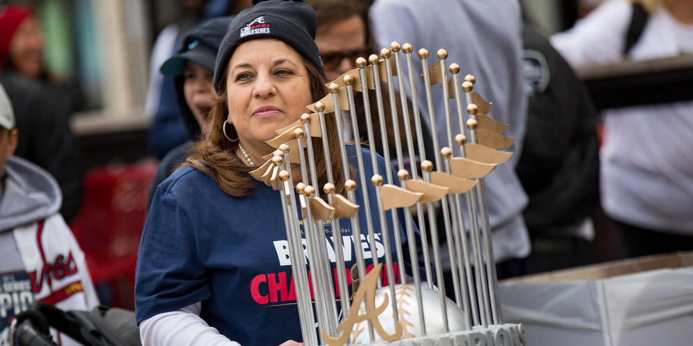 A Braves fan holds a homemade World Series Championship hat outside of Trusit Park on Nov. 5.