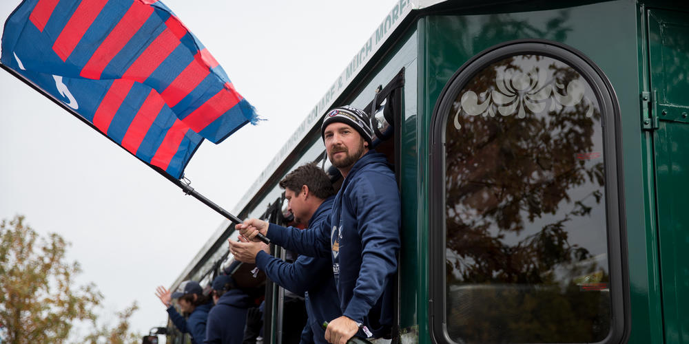Braves players and staff travel through The Battery outside Trusit Park during their celebratory parade on Nov. 5.