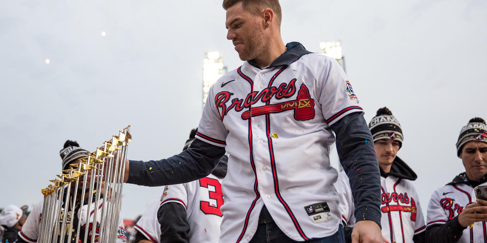 Braves first baseman Freddie Freeman admires The Commissioner's Trophy during the team’s victory celebration at Truist Park on Nov. 5.