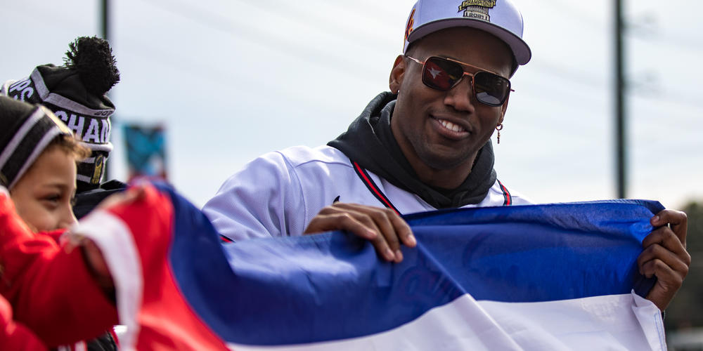 Braves player Jorge Soler celebrates while riding on the teams’ victory parade in Cobb County on Nov. 5. Soler became the first Cuban-born player to be named the 2021 World Series MVP.