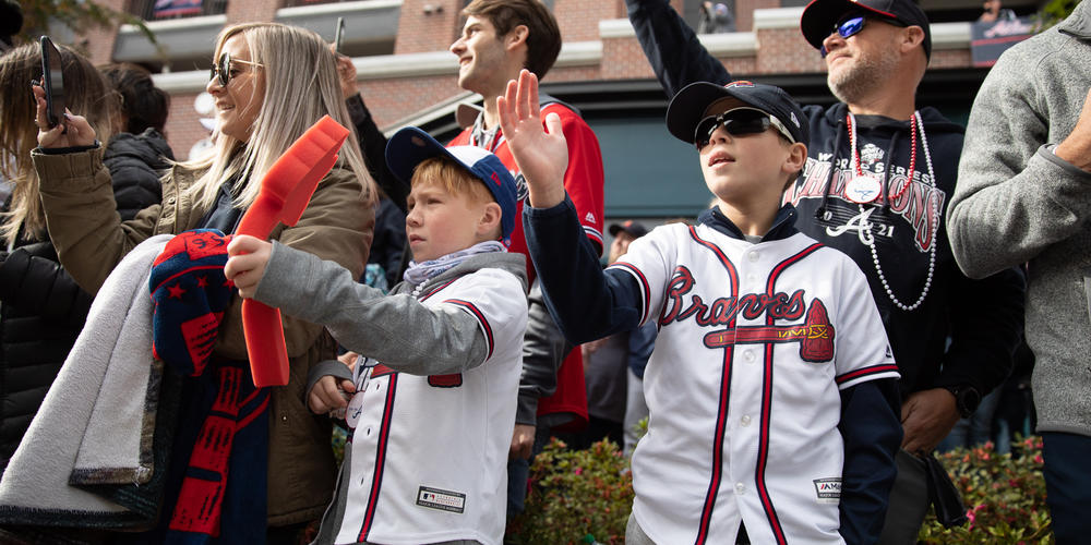 Young fans celebrate as Braves players pass by during the teams’ victory parade in Cobb County on Nov. 5.