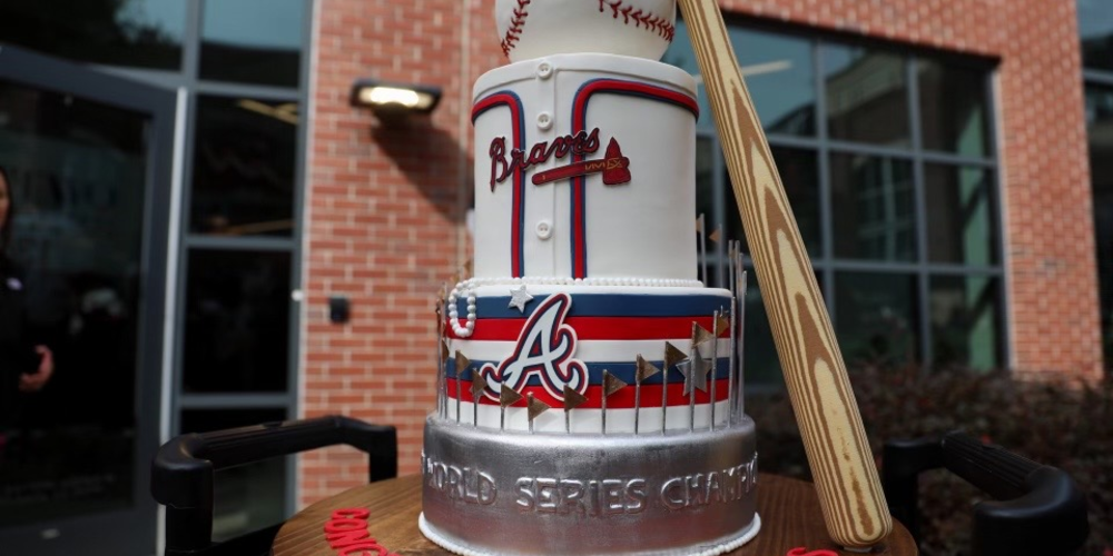 A Braves themed cake complete with baseball and bat to celebrate the World Series win.