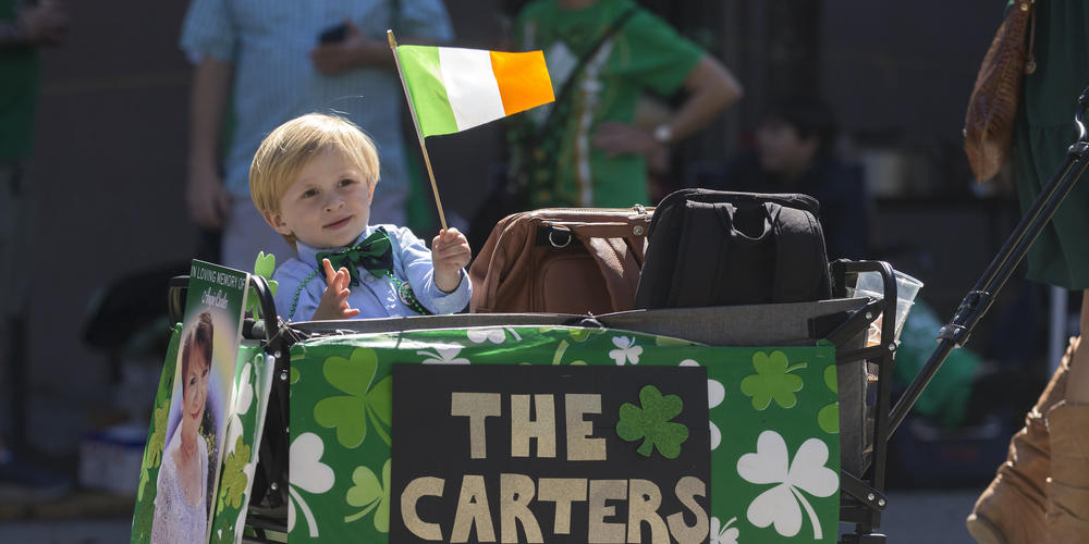 Owens Rushing of Savannah, Ga., rides in a cart with his family clan during the St. Patrick's Day parade, Thursday, March 17, 2022, in Savannah, Ga. The South's largest St. Patrick's Day celebration made a big comeback following a two-year virus hiatus.