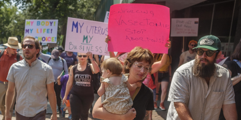 Hundreds attended a rally Sunday in Macon in protest of the overturning of Roe v. Wade. After a brief march, attendees, one after the other, shared their stories of abortion, access and choice.