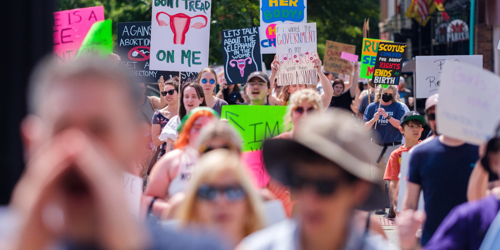 Hundreds attended a rally Sunday in Macon in protest of the overturning of Roe v. Wade. After a brief march, attendees, one after the other, shared their stories of abortion, access and choice.