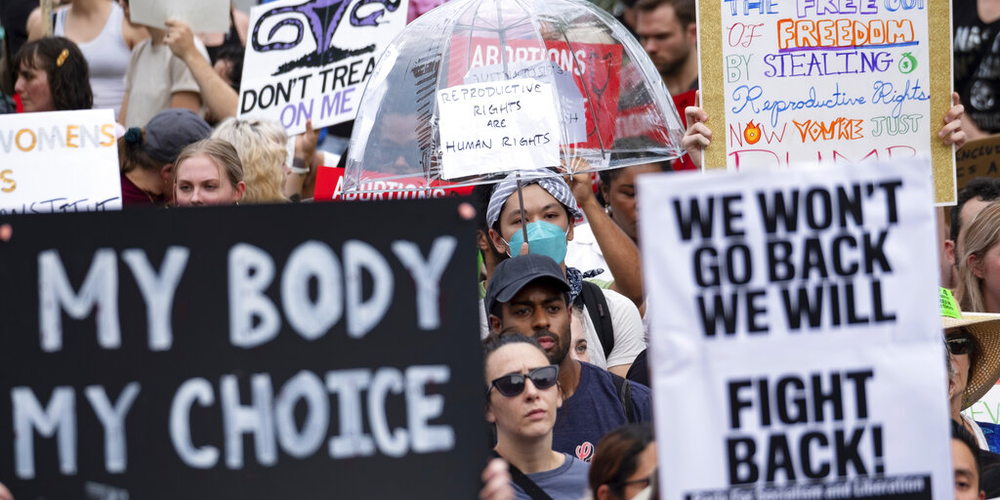 People gather in front of the Georgia State Capitol in Atlanta on Friday, June 24, 2022, to protest to protest the Supreme Court's decision to overturn Roe v. Wade.