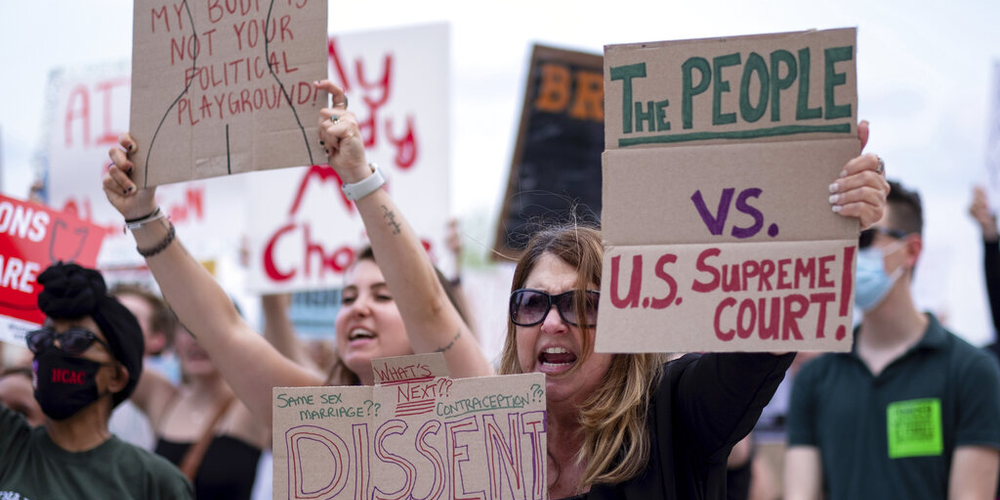 Kristy Card, right, protests with her daughter Sierra Worman in front of the Georgia State Capitol in Atlanta on Friday, June 24, 2022, against the Supreme Court decision striking down Roe v. Wade.