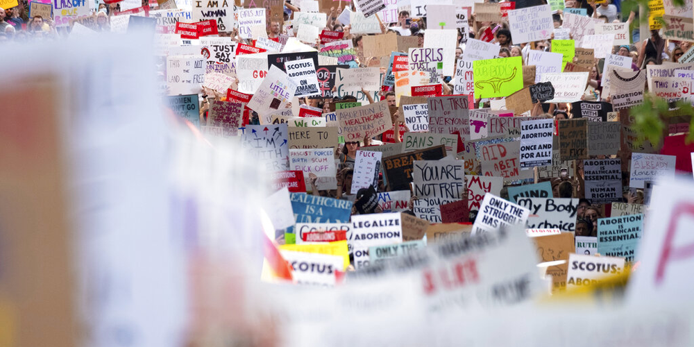 People march through Downtown Atlanta on Friday, June 24, 2022, to protest the Supreme Court's decision to overturn Roe v. Wade.  The Supreme Court on Friday stripped away women’s constitutional protections for abortion, a fundamental and deeply personal change for Americans' lives after nearly a half-century under Roe v. Wade. The court’s overturning of the landmark court ruling is likely to lead to abortion bans in roughly half the states.