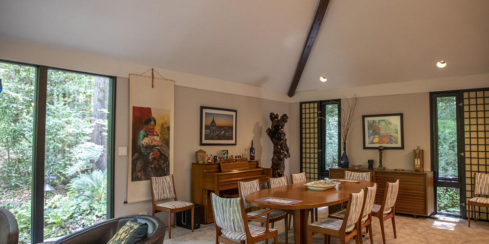 Photographs from Curtis Herwig's travels decorate the walls in the dining room.