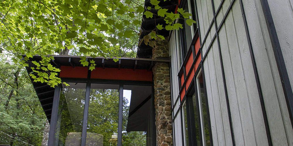 Multiple rooms in the house have floor to ceiling windows.