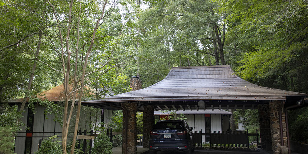 The carport is built in a style to match the home.