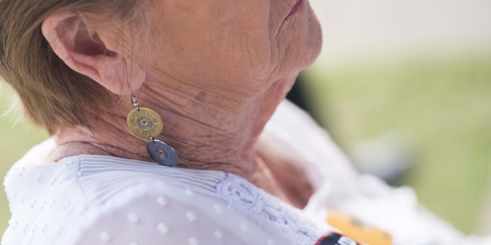 A Kemp supporter with shotgun shell earrings.