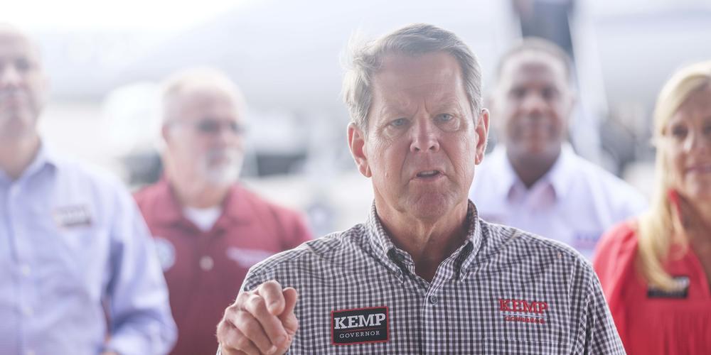 Georgia Governor Brian Kemp is backed by his wife and much of the down ballot Republican ticket during a campaign stop in Macon on the day before Election Day.